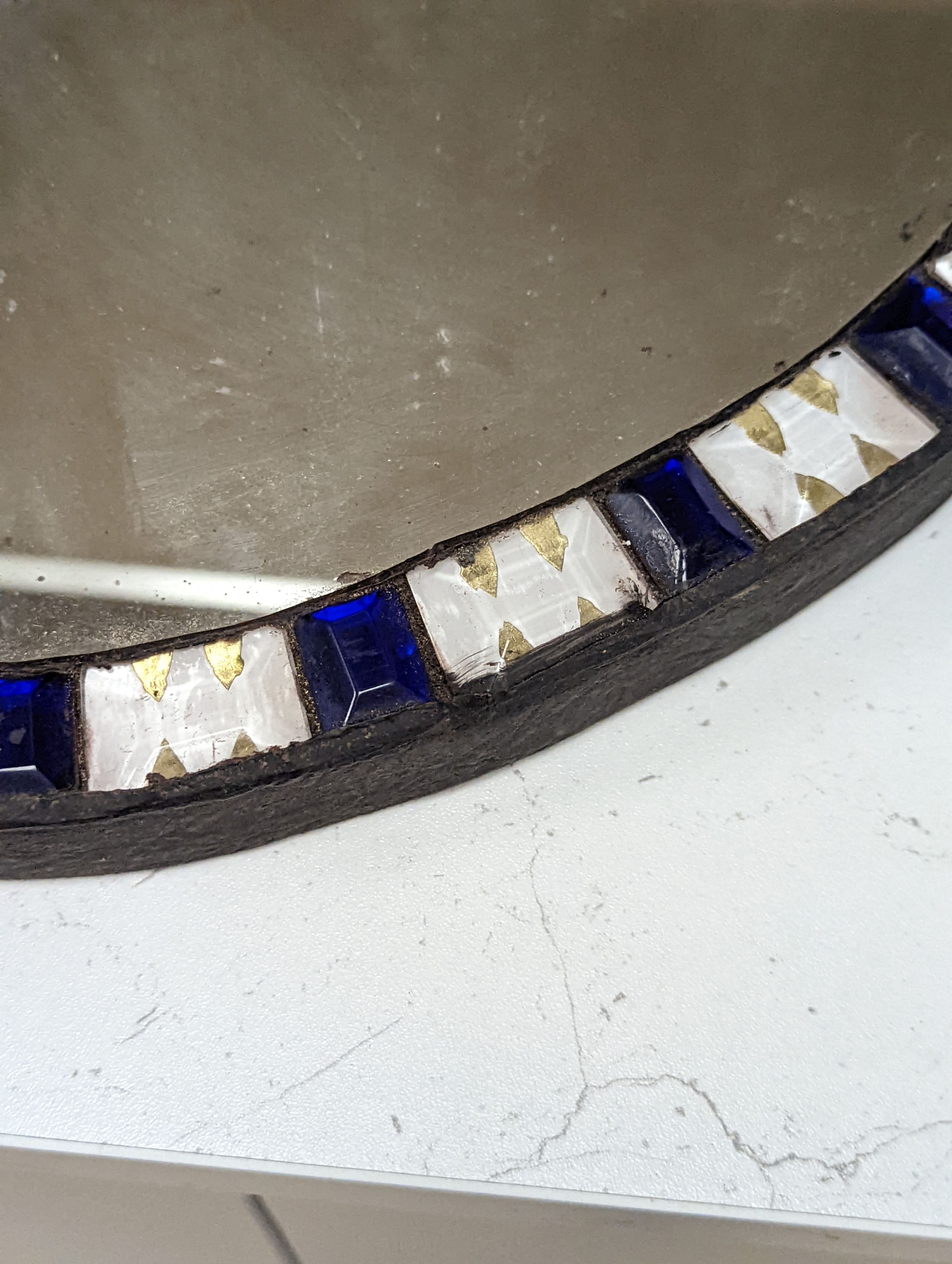 An oval Irish-style wall mirror, 56x41cm